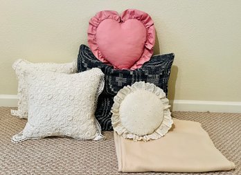 Variety Of Throw Pillows And Blanket