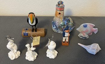 A Collection Of Nautical Items And Seashell Picture Holders