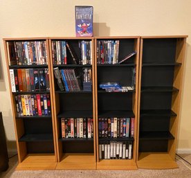 4 Shelves Of DVDs And VHS