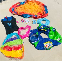 Lot Of Pool Inflatables And A Wet Suit Top