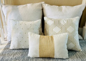 Assortment Of White And Gold Decorative Throw Pillows