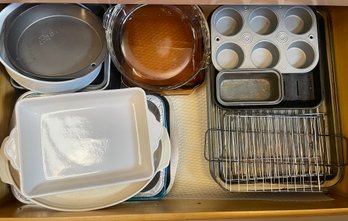 Assortment Of Bakeware Including Pie Dishes And Cooling Racks