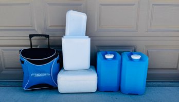 Assortment Of Water Jugs And Coolers