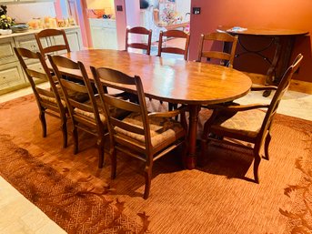 Hardwood Oval Dining Room Set With 8 Captain Chairs And Wool Area Rug