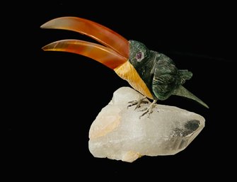 Tucan Sitting On A Geode Made Of Sodalith And Rose Quarz