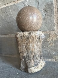 Stone Ball Atop A Bone Pedestal