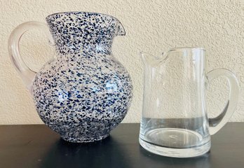 One Glass Pitcher And One Melamine Speckled Pitcher