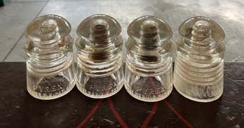 Four Pyrex Embossed Glass Insulators