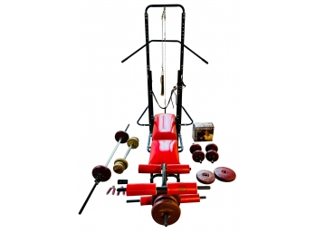 Red DP Bench Press With Additional Weights And Accessories