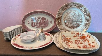 Collection Of Various Styled Porcelain Plates And Decor
