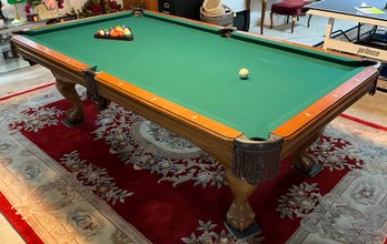 Traditional Pool Table With Lots Of Accessories Including Pool Sticks