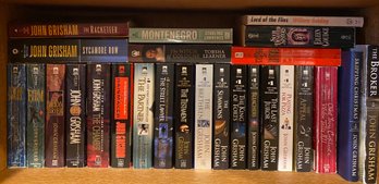 Assortment Of Books With Some By John Grisham And More