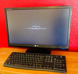 LG Flatron E2241 Computer Monitor With Logitech K120 Keyboard