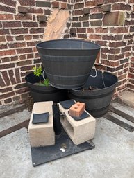 Three Outdoor Hard Plastic Pots And Metal Umbrella Stand