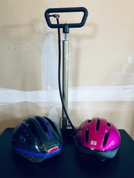 Pair Of Bike Helmets And Pump
