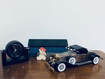 Assortment Of Decor Including Model Car And Small Clock