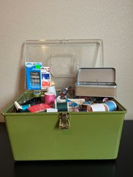 Green Plastic Sewing Bin With Assortment Of Sewing Essentials