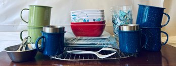 Assortment Of Camping Essentials Including Mugs, Plates And Utensils