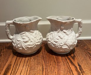 Pair Of Portuguese Embossed Ceramic Pitchers