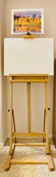 Wood Easel With Canvas, Paint Brushes, Paintings And Art Technique Books