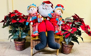 Santa & Elves In Chair With Poinsettia Flowers