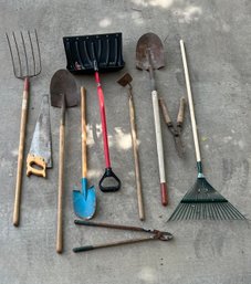 Variety Of Outdoor Tools Including Shovels, Cutters, And More