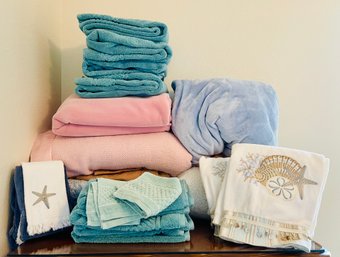 Assortment Of Towels, Including Coastal Themed Ones
