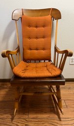 Wooden High Back Rocking Chair With Orange Cushions