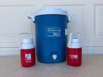 Large Rubbermaid Water Cooler And Small Hand Held Water Coolers