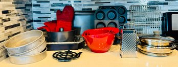 Lot Of Kitchen Essentials Including Baking Pan, Muffin Pan, Measuring Bowls, Trivet And More!