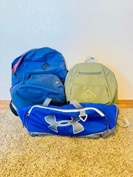Three Travel Bags Underarmour And Herschel