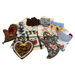 Assortment Of Kitchen Towels And Pot Holders