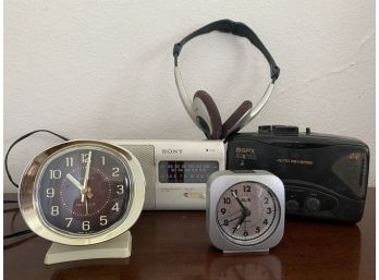 A Collection Of Electronics Including Mid Century Clock And Sony