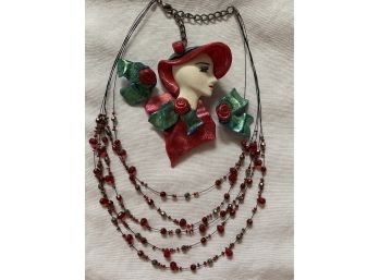 A Nice Grouping Of Costume Jewelry Including Clay Style Lady Pin And Multi Strand Necklace