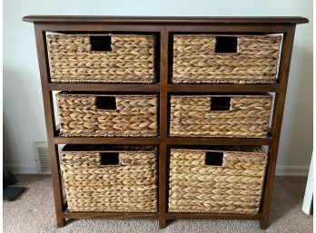 A Nice Storage Cabinet With Woven Basket Inserts