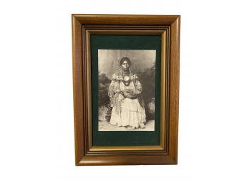 An Antique Print Of A Native American Woman Seated With Bowl And Jewelry