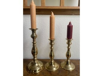 A Nice Trio Of Brass Candlesticks Including One Heavy Antique Piece