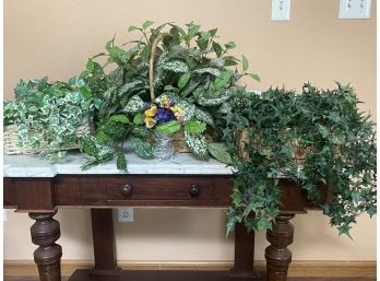 A Grouping Of Artificial Decorative Plants Including Flowers And Ferns