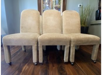 Six Velveteen Upholstered Chairs On Wheels With Brass Hardware In Buttercream Yellow