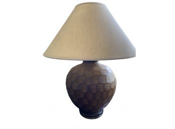 A Honeycomb Ceramic Table Top Lamp With Oatmeal Shade