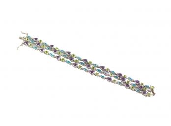 Sterling Silver And Multi Strand Bracelet With Safety Claps Featuring Blue Topaz, Amethyst And Peridot