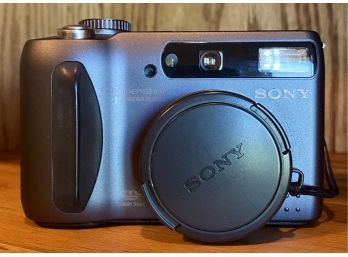Sony Cyber Shot Camera With Cords, Manual, And Compatible Case