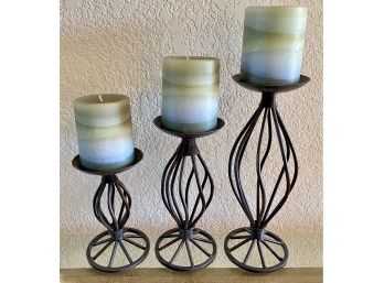 Three Taper Metal Candle Holders With Candles