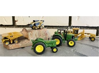 Two John Deere Tractors And Bobcat Toys