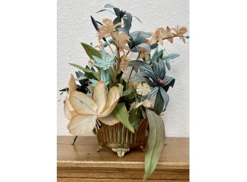 A Silk Flower Arrangement In A Footed Brass Vase