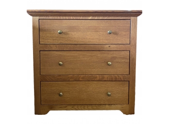 Woodley's Three Drawer Oak Nightstand With Dovetailed Joints And Brass Knobs