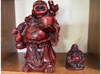 A Pair Of Two Resin Buddha Figures