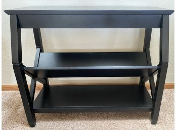 A Media Side Table With Magazine Or Book Storage Shelving