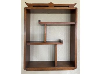 A Pagoda Style Wood Open Shelving Piece