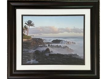 A Beautiful Photograph Of Kauai With Waves Crashing Over Rocks